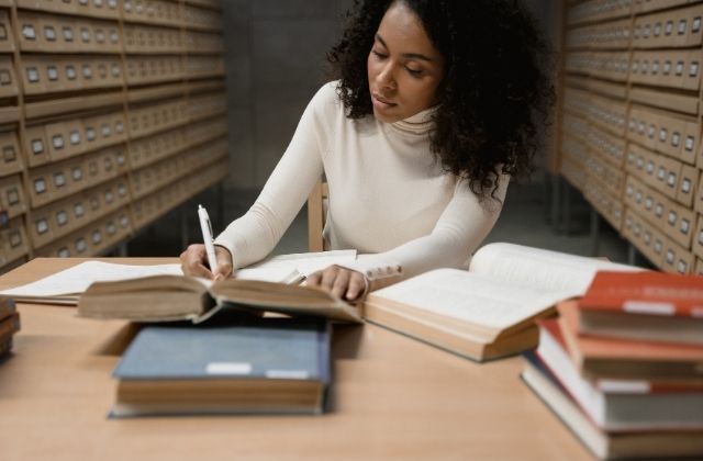 Postgraduate student planning a literature review synthesis